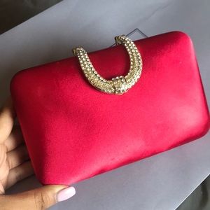 Red satin clutch bag